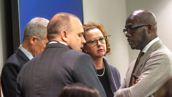 Former District Attorney Jackie Johnson, second from right, stands with her defense attorneys in court