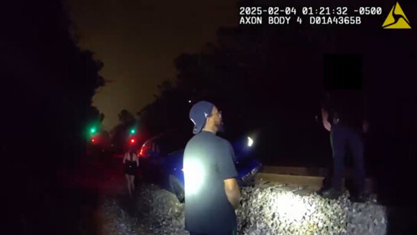 Marcus Jordan is seen speaking with officers