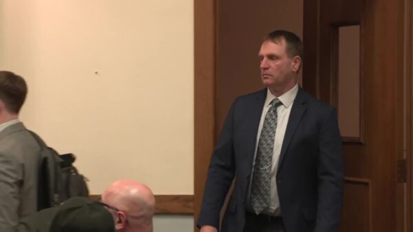 Timothy Hauschultz walks into court