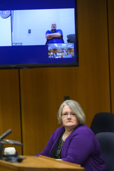 Tanya Zuvers looks away as her former husband John Skelton appears via video