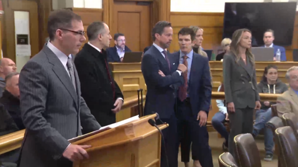 Karen Read and her attorneys stand in court next to Hank Brennan