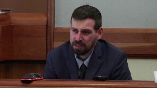 middle-aged man sobs on the stand