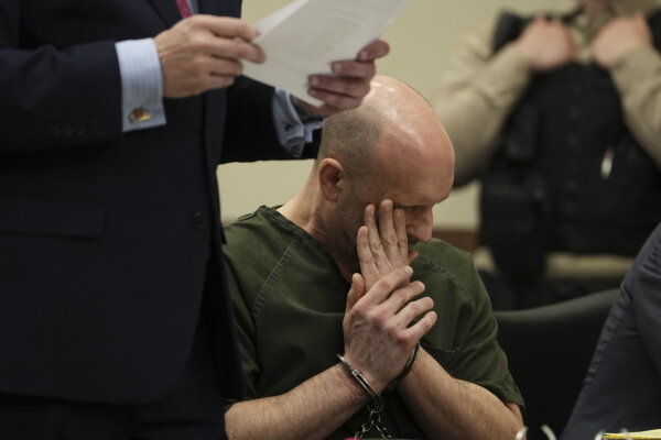 Sean Higgins wipes away tears in court