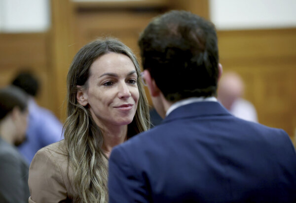 Karen Read confers with Robert Alessi in court.
