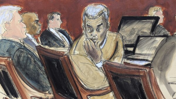 Sean "Diddy" Combs, right, blows kisses