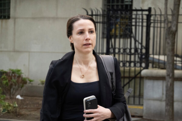 Prosecutor Christy Slavik enters court