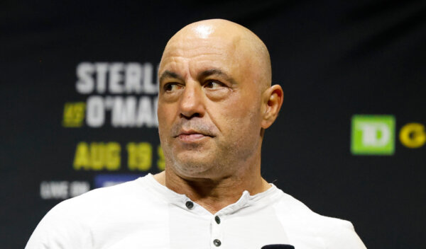 Joe Rogan looks on at the ceremonial weigh-in