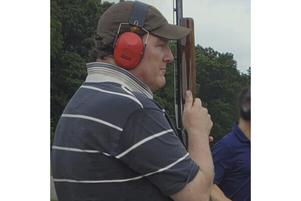 Rex Heuermann holds a gun