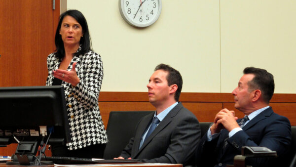 Dr. Husel in court with his attorneys
