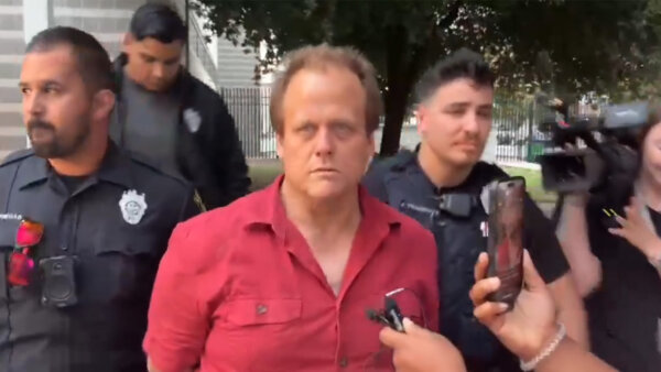 Charles Byrd is escorted by deputies