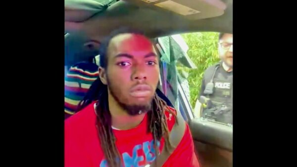 William McNeil Jr. is seen sitting in his car