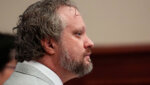 James Craig sits in court