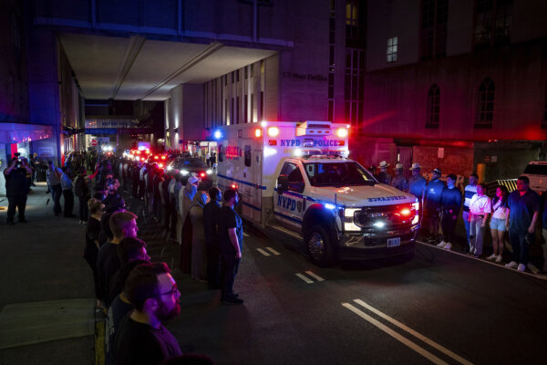 Ambulance drives down street