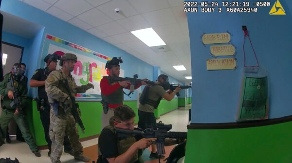 law enforcement agents ready their weapons during the shooting at Robb Elementary School in Uvalde