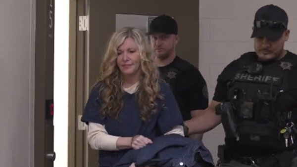 Lori Daybell is escorted by officers 