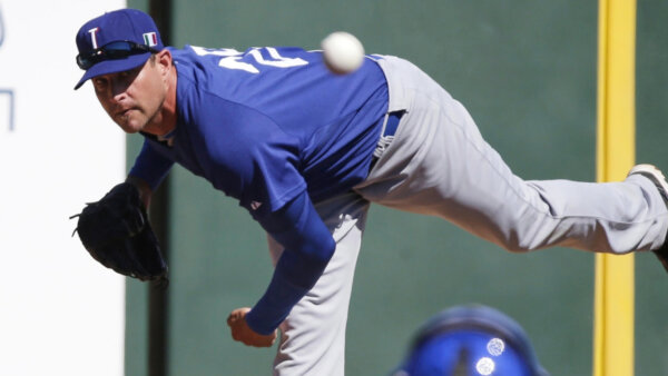 Italy's Dan Serafini throws before the first inning