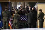 U.S. Border Patrol agent David Maland is recognized with military honors before his burial