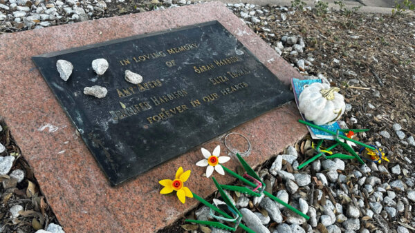 Tributes lay on a memorial Friday, Sept. 26, 2025, for four teenage girls