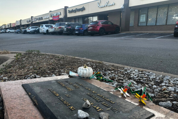 Tributes lay on a memorial Friday, Sept. 26, 2025, for four teenage girls