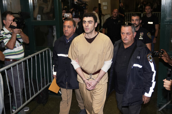 Luigi Mangione is escorted into court