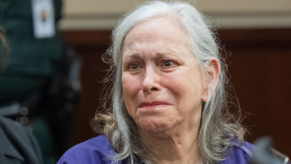 Donna Adelson looks towards her husband, Harvey Adelson during her sentencing