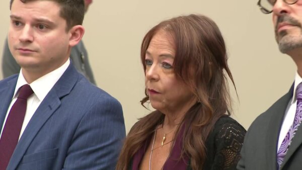 Kimberly Sullivan stands with her attorneys in court