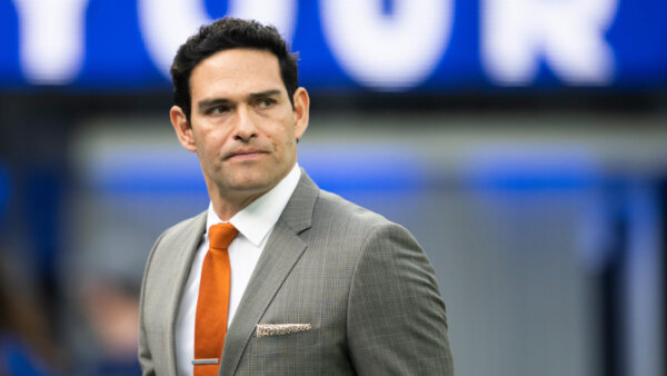 Mark Sanchez walks on the field before an NFL football game