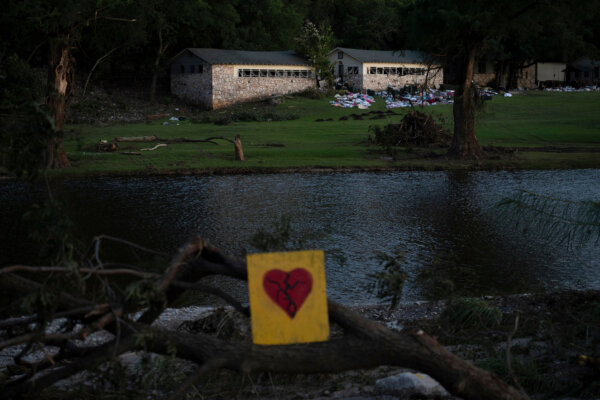A broken heart sign is displayed near Camp Mystic