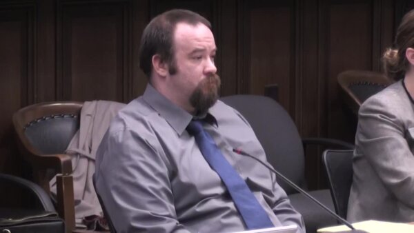 Defendant Luke Truesdell listens as prosecutors deliver opening statements