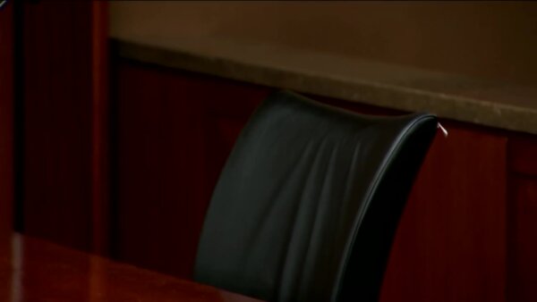 Empty chair at counsel table