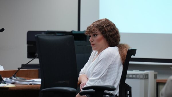 Ashlee Buzzard sits in court