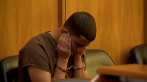 Derek Rosa holds his ears