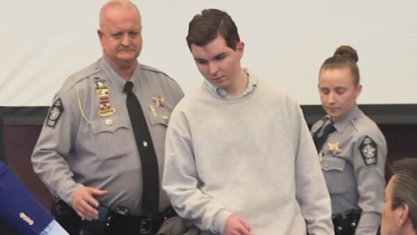 Austin Thompson enters court