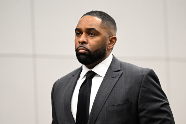 Sherrone Moore, center, appears in the courtroom
