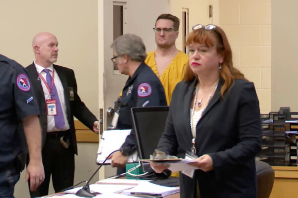 Michael McKee walks into court