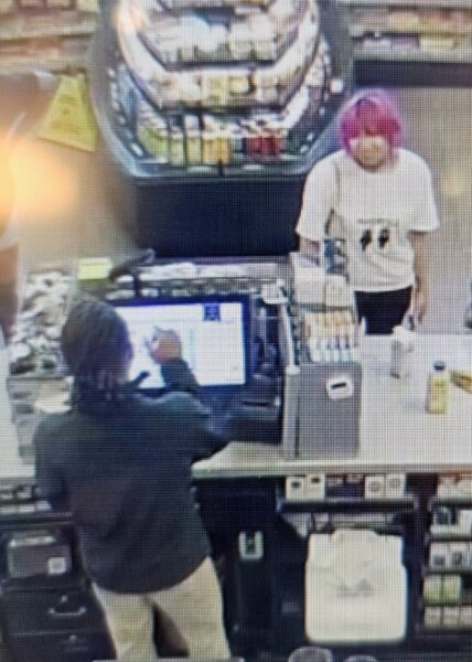 Surveillance photo of woman at store