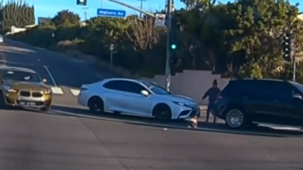 Image from video shows the scene where a 19-month-old child fell from a vehicle in La Habra
