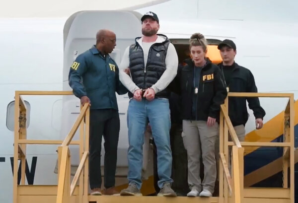 Man handcuffed outside plane on runway