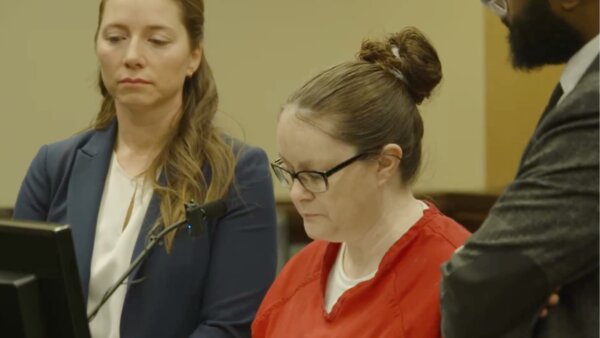 Katie Lee reads a statement in court