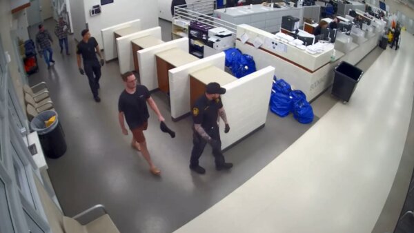 Michael McKee is seen walking tghrough jail