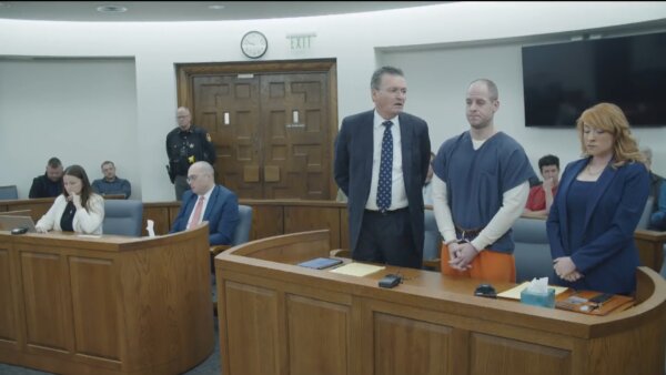 Caleb Flynn stands in court