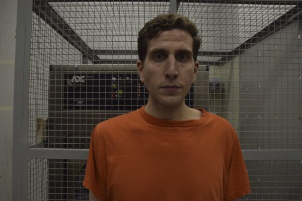 Kohberger stands in front of camera