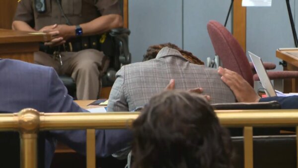 Ebony Parker puts head down on table